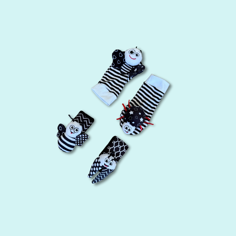 Set of black and white baby wrist band rattles and foot finder socks with animal faces and crinkle textures for sensory discovery and movement tracking – Babyroos 0–3 month toy