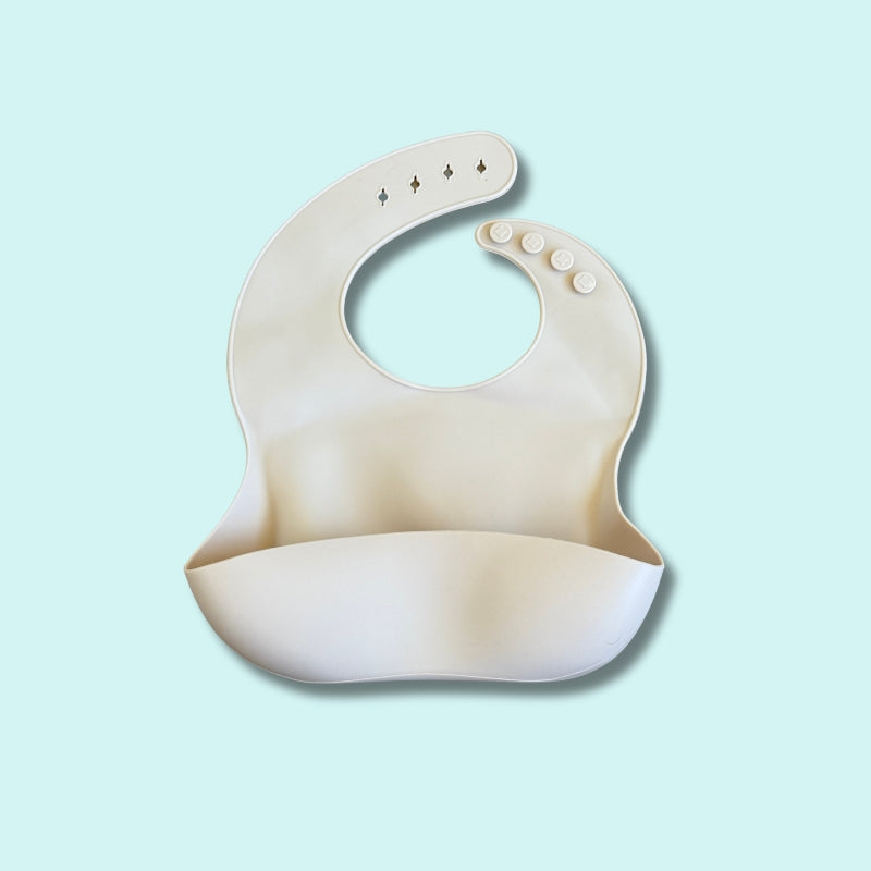 Adjustable silicone baby bib with deep spill pocket in neutral beige – Babyroos waterproof feeding bib for mess-free mealtimes