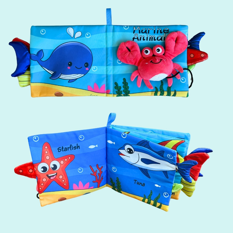 Marine animal soft cloth book with crinkle textures, 3D plush crab, and colourful ocean illustrations for sensory play and language learning – Babyroos 6–12 month baby book