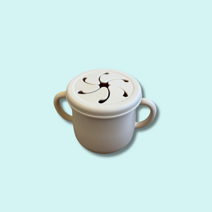 Soft silicone snack cup with spill-proof lid and twin handles in beige – Babyroos toddler snack container for on-the-go feeding