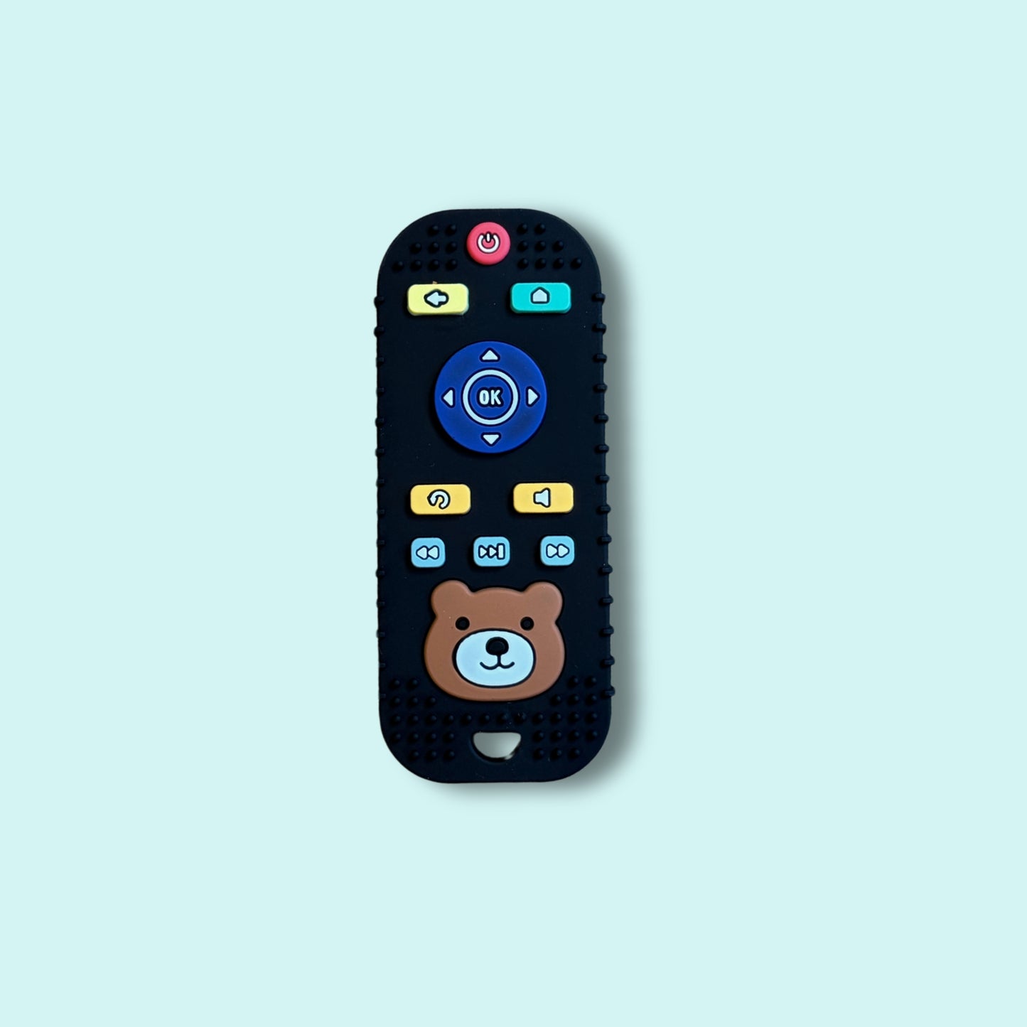 Black silicone baby teething toy shaped like a TV remote with colourful buttons and a cute bear face, designed for sensory play and gum relief