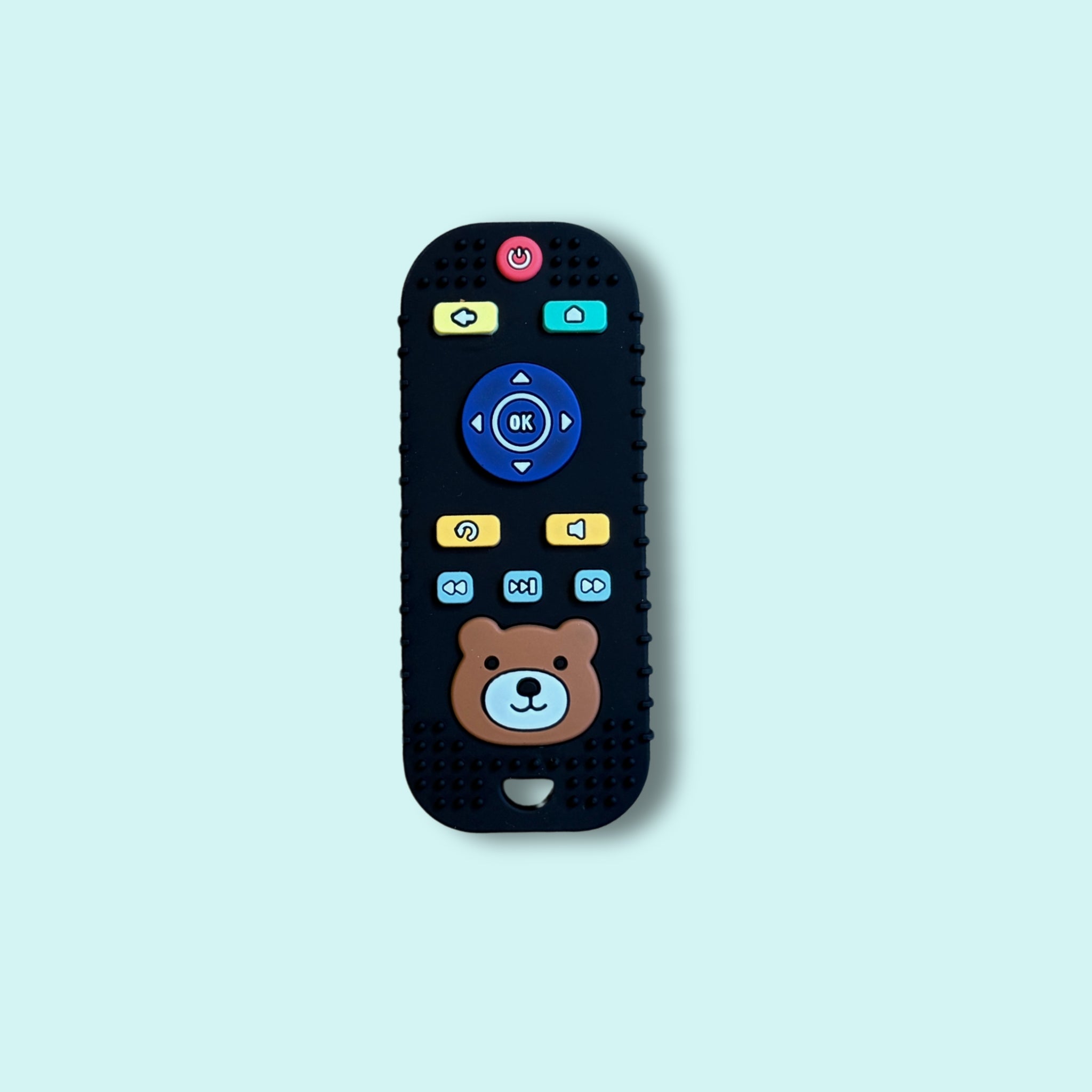 Black silicone baby teething toy shaped like a TV remote with colourful buttons and a cute bear face, designed for sensory play and gum relief